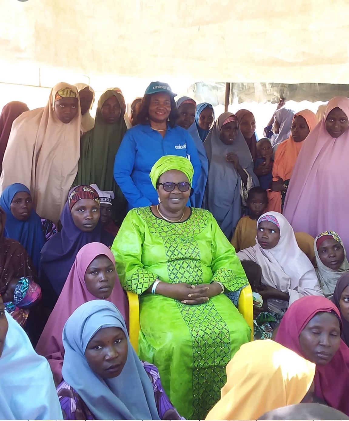 Kwara state Commissioner for Budget and Economic Planning,  Dr Mary Arinde amidst caregivers in Kudai sites in Dutse.