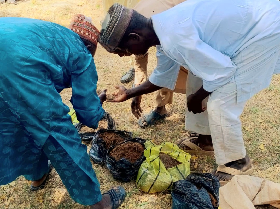 Farmers inspecting the best Compost.