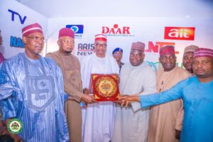Representative of Kano State Governor receiving the award of Journalist-Friendly Governor.